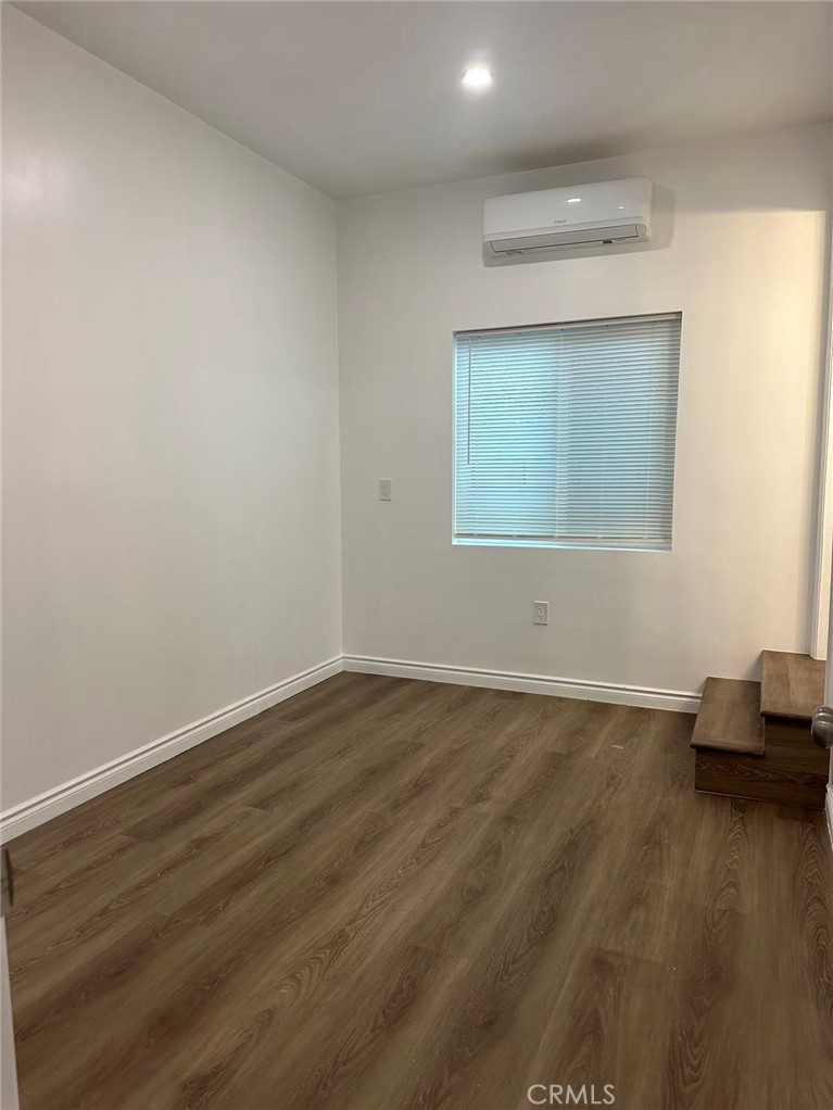 3044 Hodges Avenue Arcadia, CA 91006 - Photo 7 of 13 a view of an empty room with wooden floor and a window