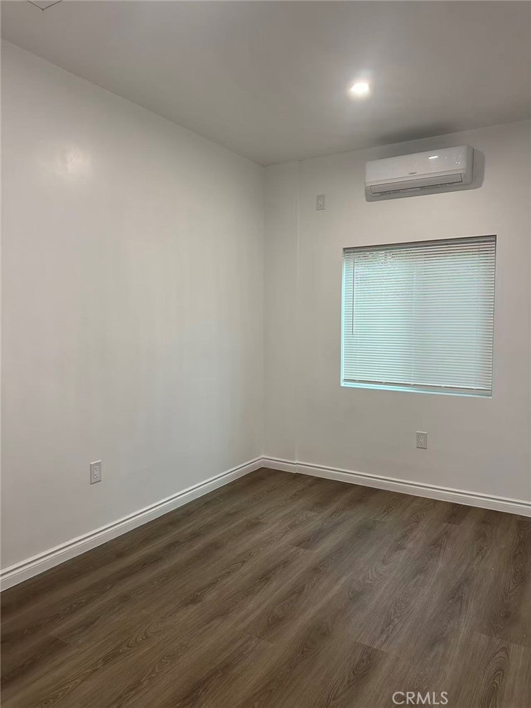3044 Hodges Avenue Arcadia, CA 91006 - Photo 8 of 13 an empty room with wooden floor and windows