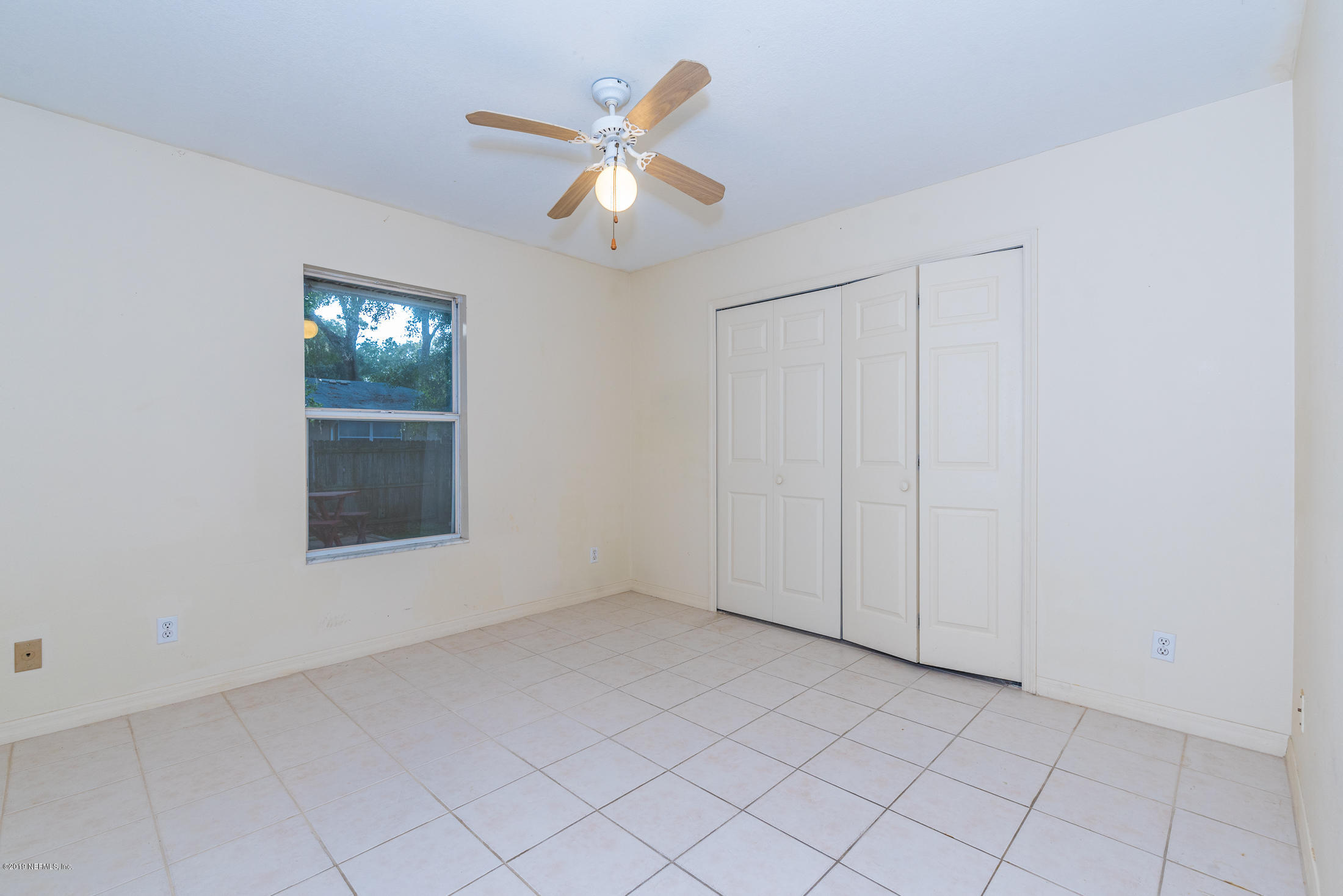 922 Queen Road St. Augustine, FL 32086 - Photo 18 of 40 an empty room with windows and fan