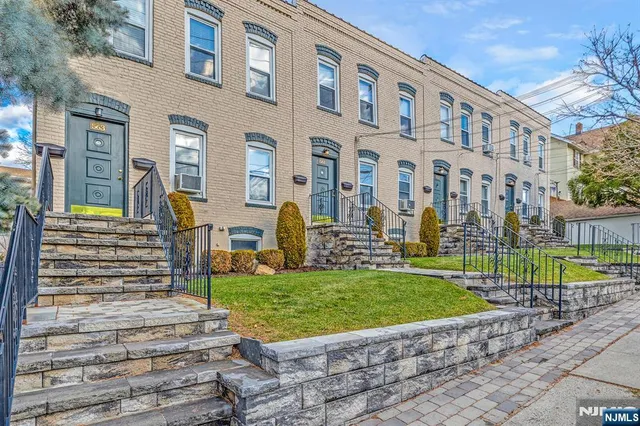 a view of a building with a yard