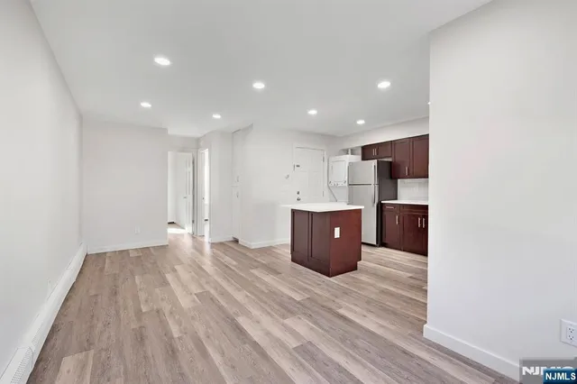 a view of kitchen with wooden floor
