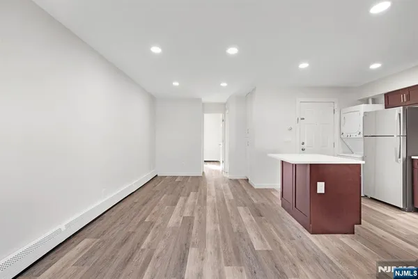 a view of kitchen with wooden floor