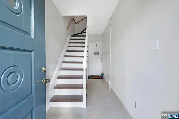 a view of entryway with wooden floor