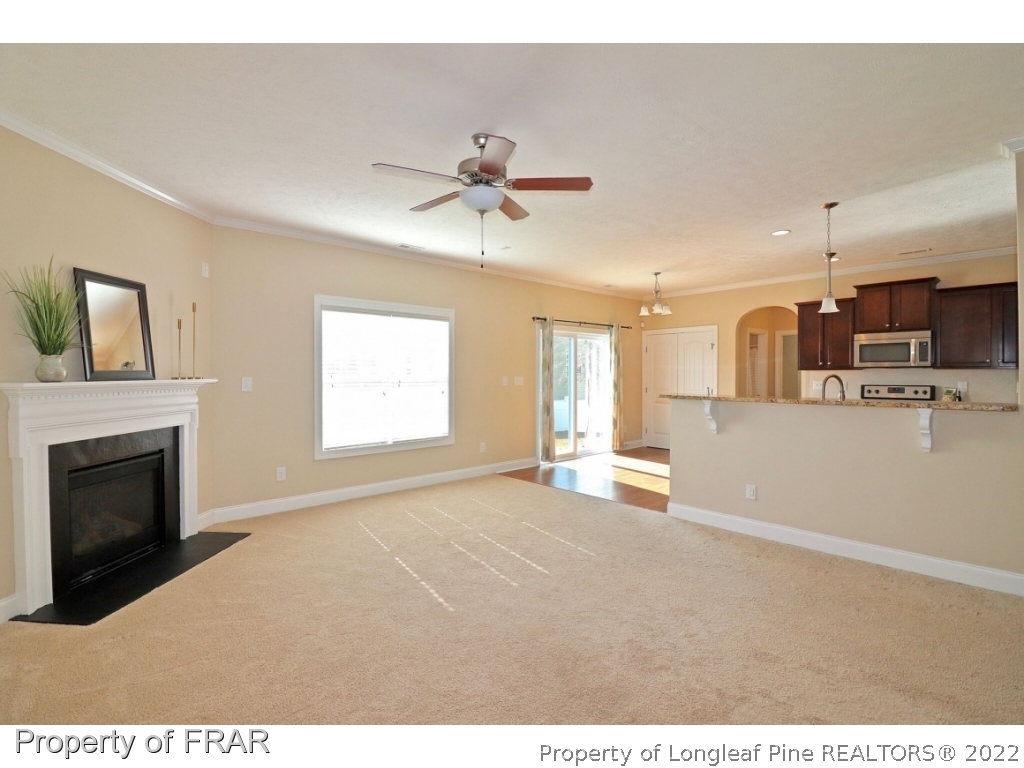 138 Culpepper Road Cameron, NC 28326 - Photo 7 of 30 a view of empty room with a fireplace and fan