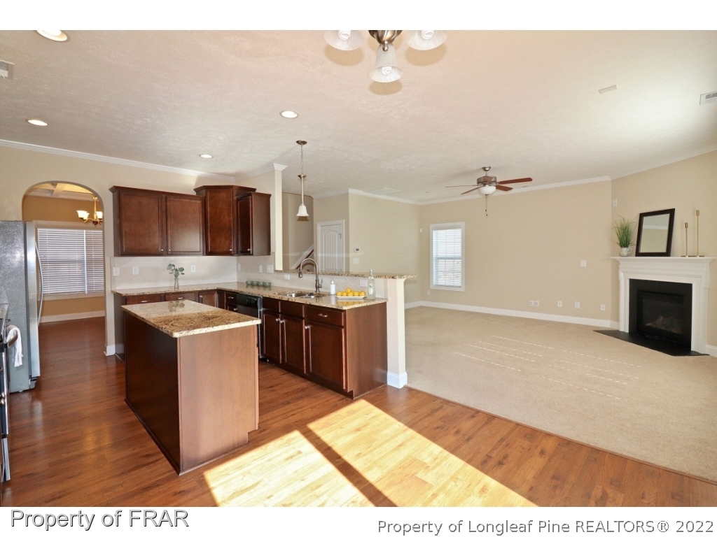 138 Culpepper Road Cameron, NC 28326 - Photo 8 of 30 a large kitchen with stainless steel appliances granite countertop a stove and a sink
