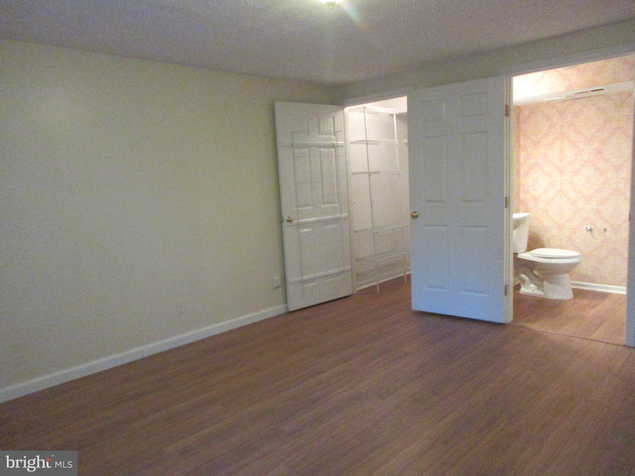87 Eldon Way Marlton, NJ 08053 - Photo 11 of 22 a view of a room with wooden floor and a toilet