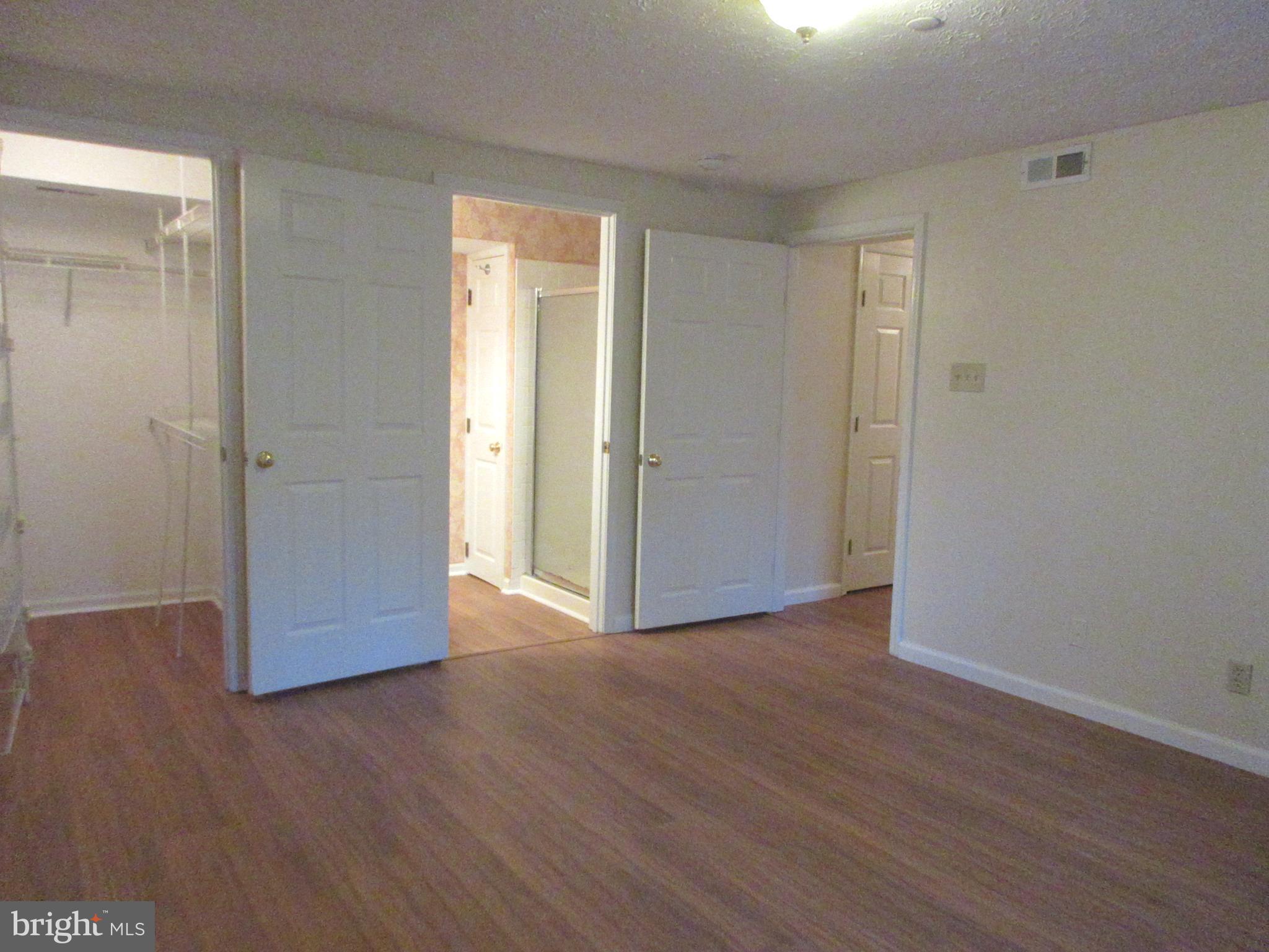 87 Eldon Way Marlton, NJ 08053 - Photo 12 of 22 a view of an empty room with wooden floor & closet