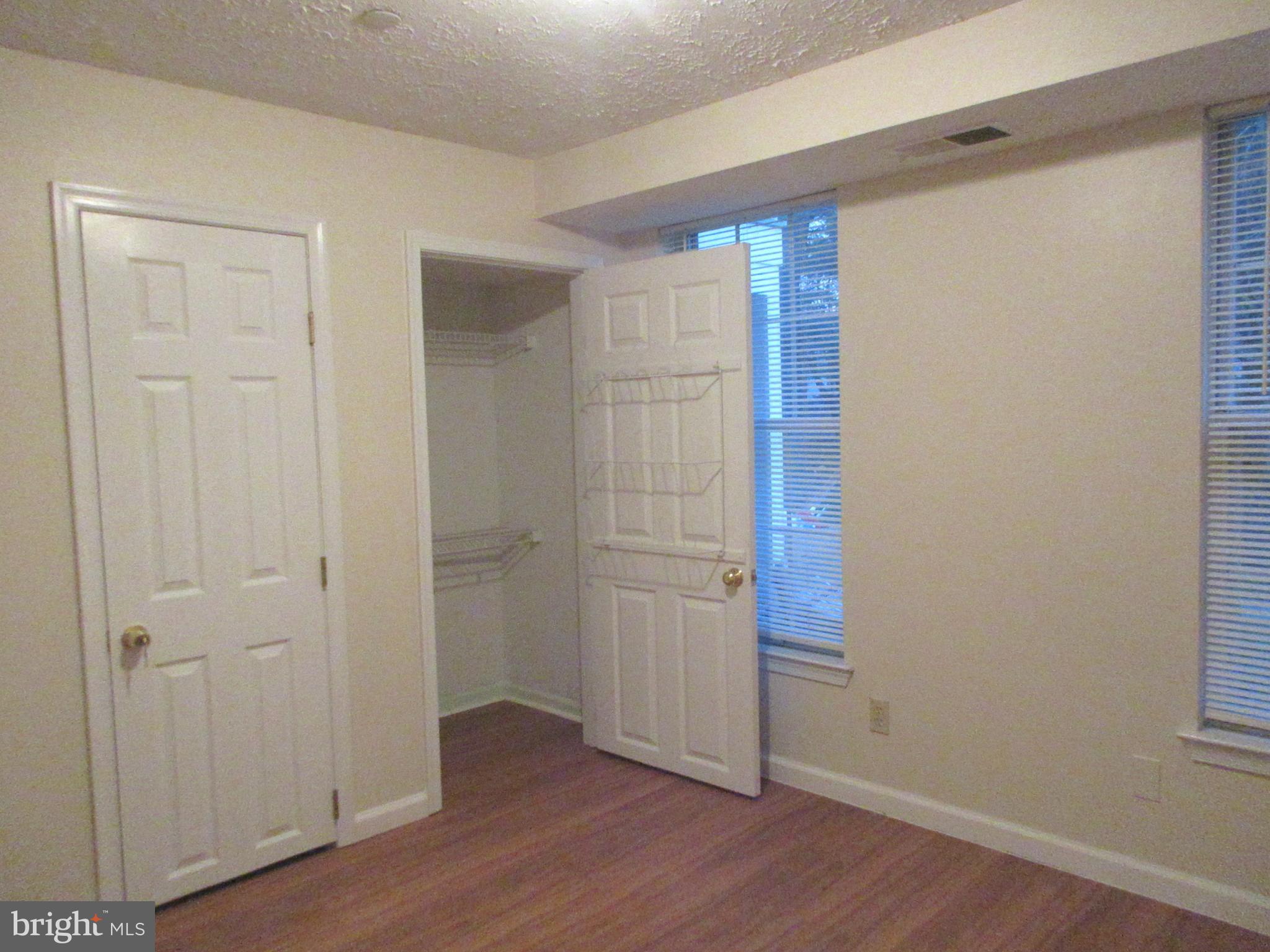 87 Eldon Way Marlton, NJ 08053 - Photo 14 of 22 a view of an empty room with wooden floor