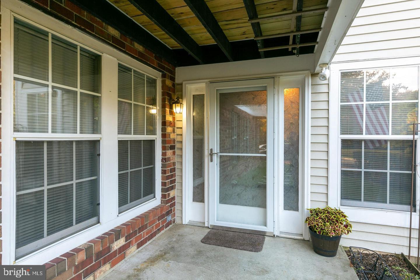 87 Eldon Way Marlton, NJ 08053 - Photo 2 of 22 a view of a door with a glass door and a large window