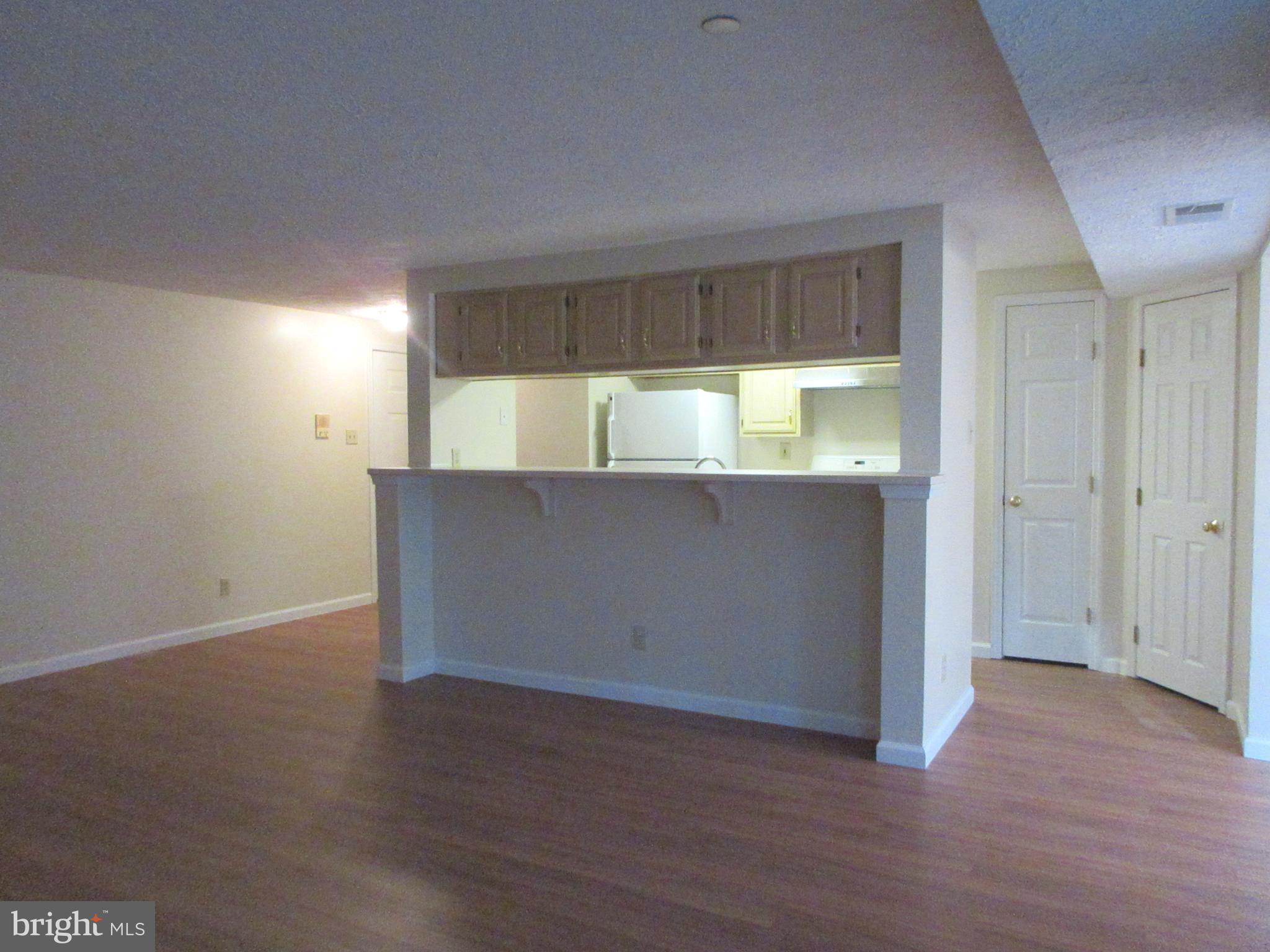 87 Eldon Way Marlton, NJ 08053 - Photo 3 of 22 an empty room with wooden floor and windows