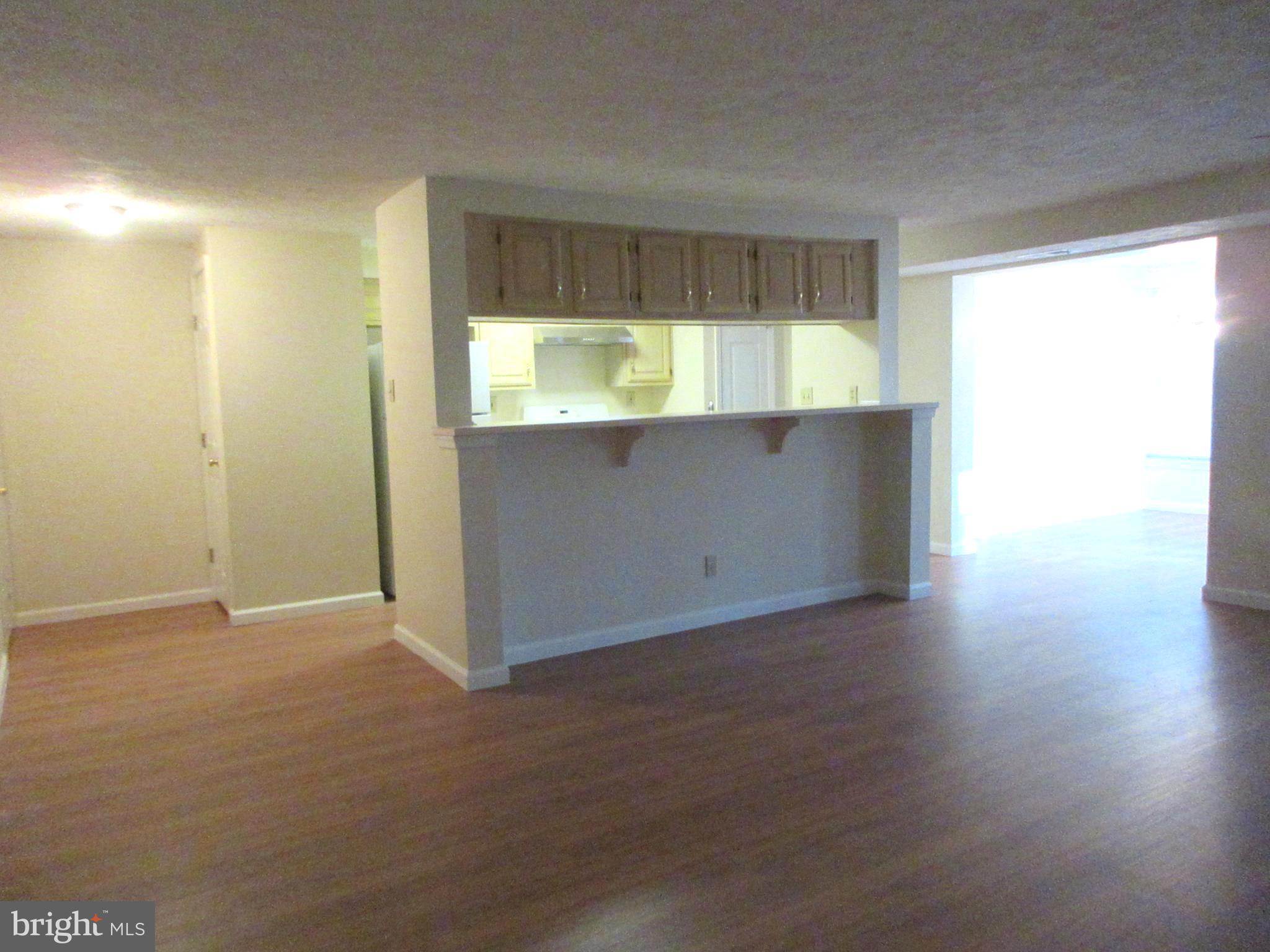 87 Eldon Way Marlton, NJ 08053 - Photo 6 of 22 an empty room with wooden floor and windows
