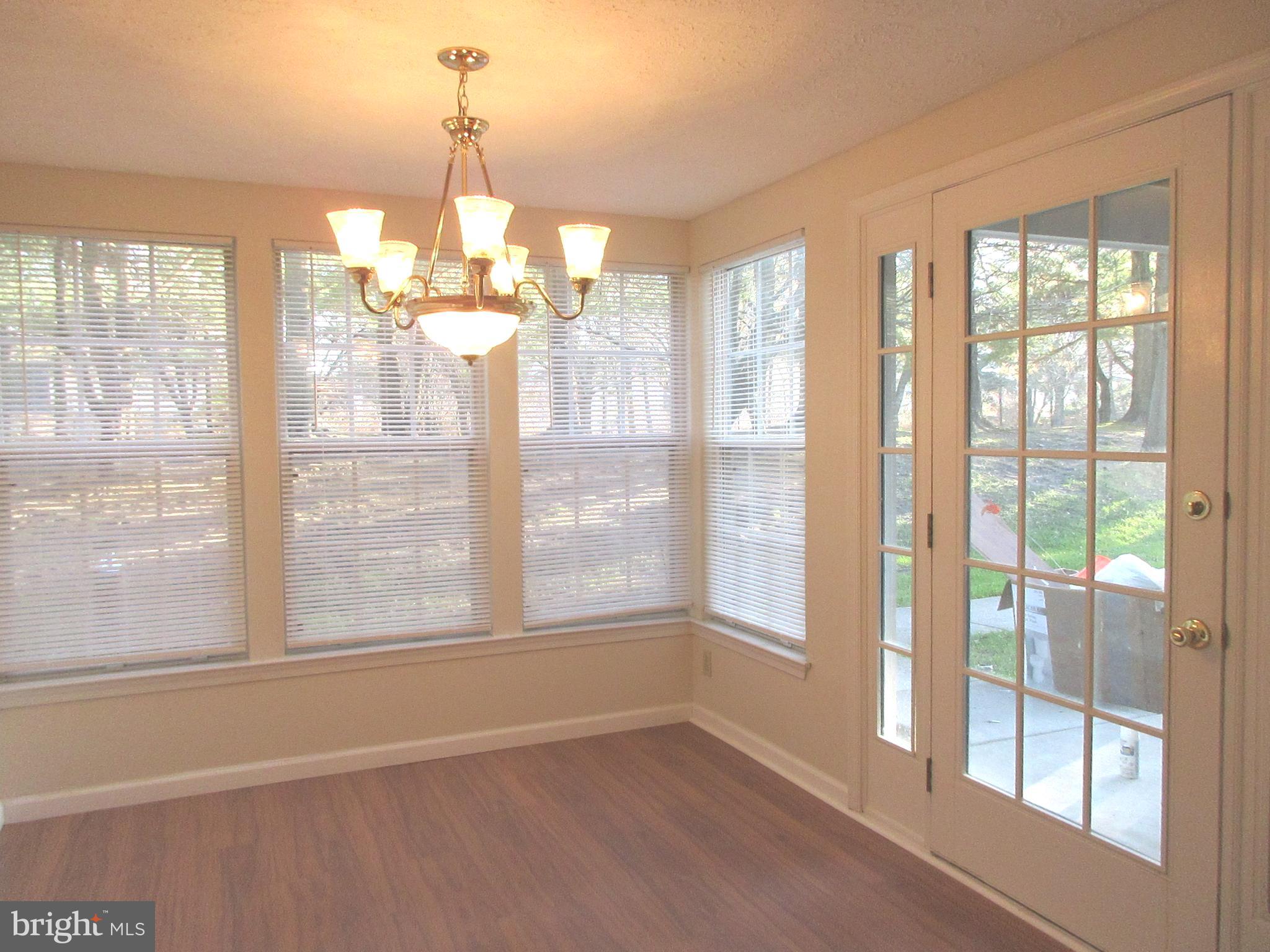 87 Eldon Way Marlton, NJ 08053 - Photo 9 of 22 a view of a room with large windows