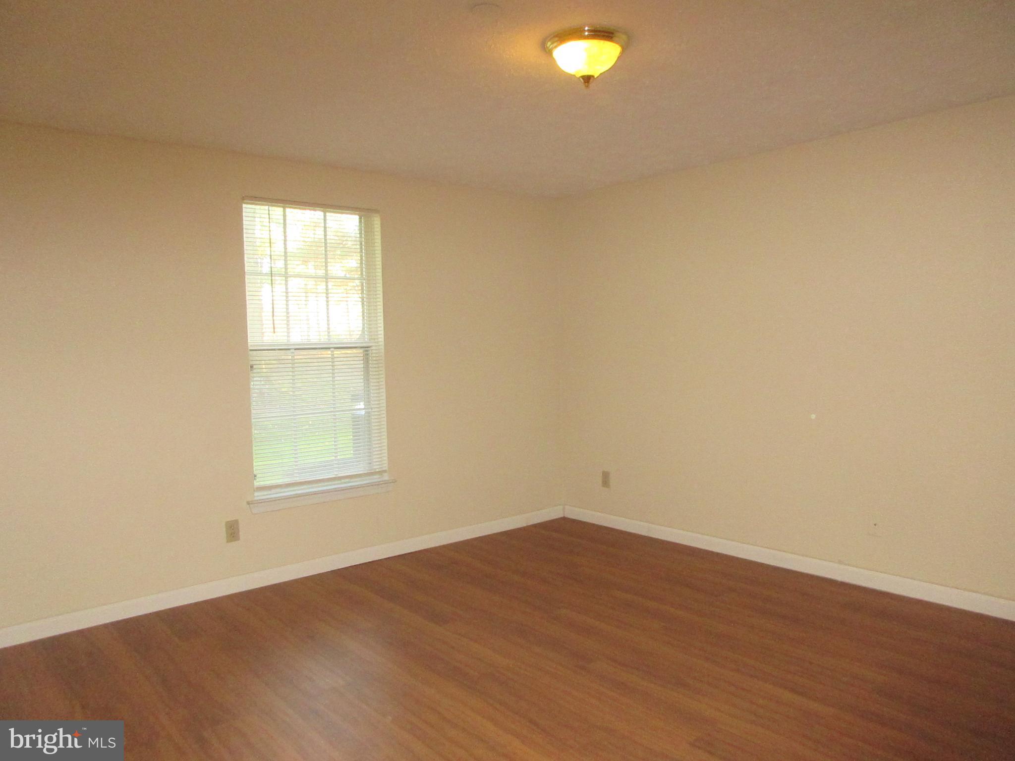 87 Eldon Way Marlton, NJ 08053 - Photo 10 of 22 an empty room with wooden floor and windows