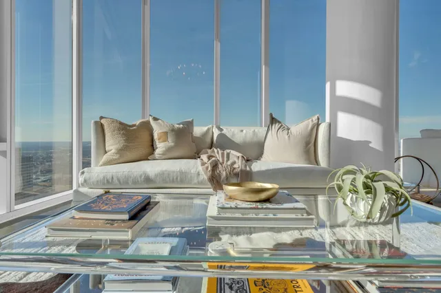 a living room with furniture and a rug