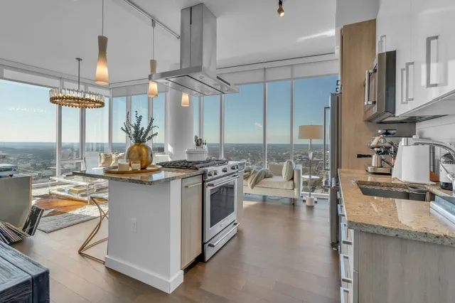 a kitchen with a stove a sink and a refrigerator
