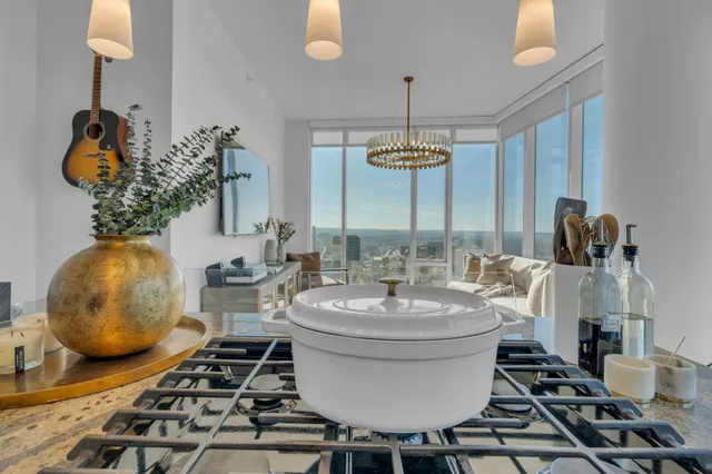 a room with a table chairs and entryway