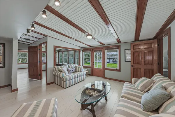 a bedroom with a bed and ceiling fan