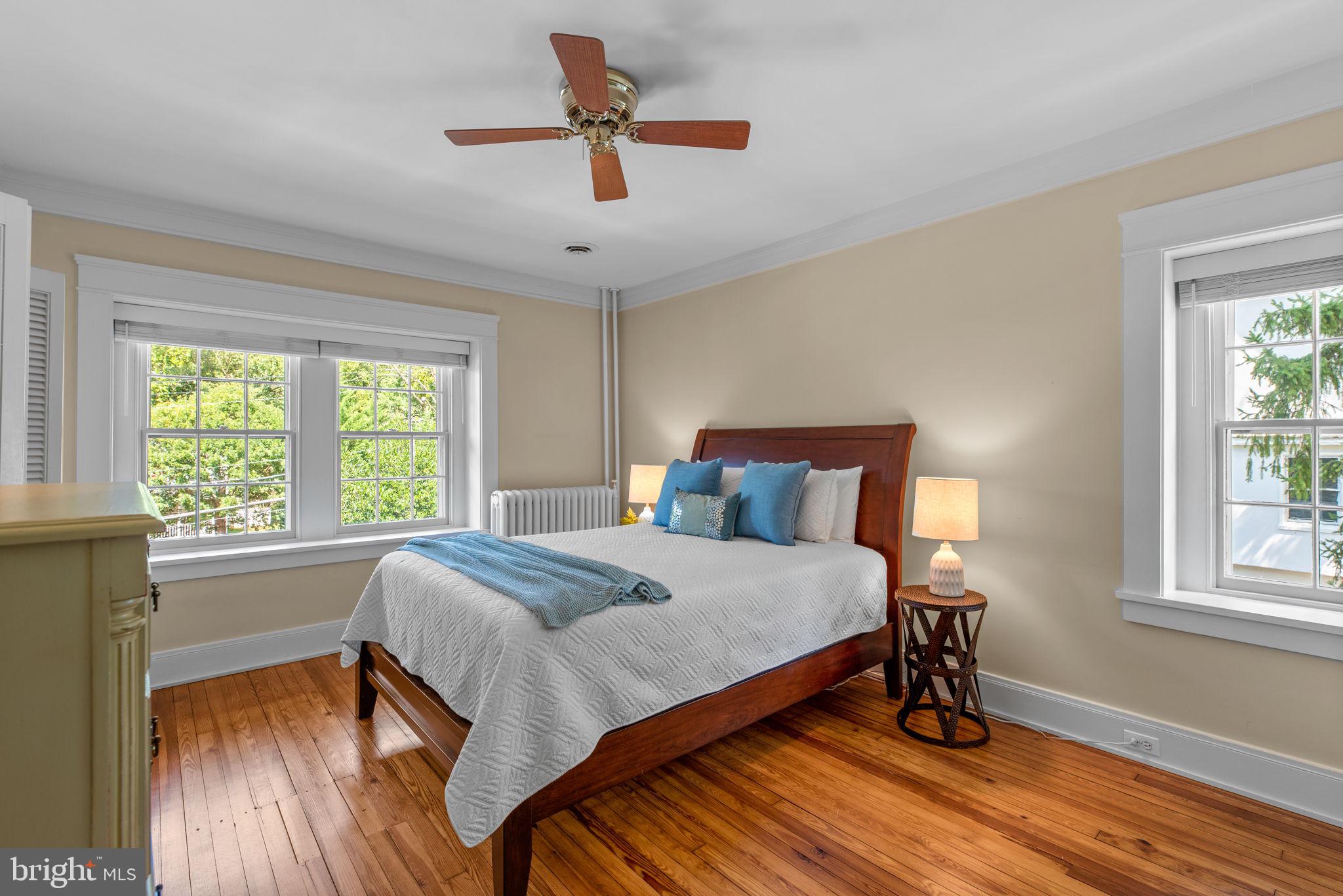 1703 Frederick Road Baltimore, MD 21228 - Photo 29 of 71 Primary bedroom w/ceiling fan, heart pine floors