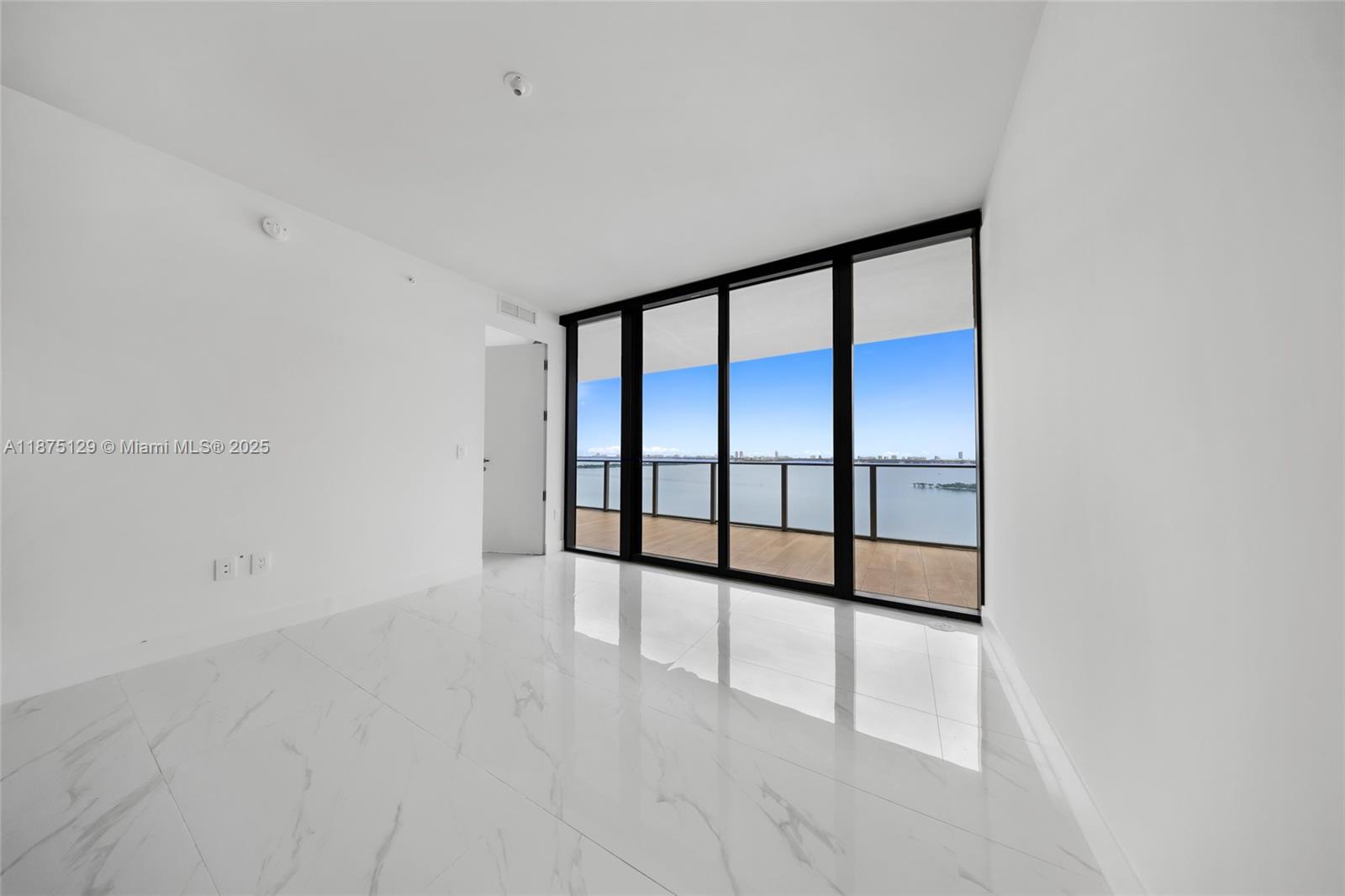 700 Northeast 24th Street, Unit 1706 Miami, FL 33137 - Photo 20 of 95 a view of an empty room with a window