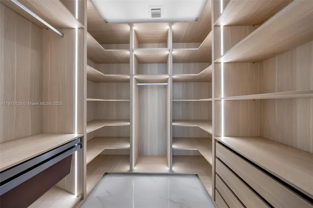 a view of swimming pool with a dining table and chairs