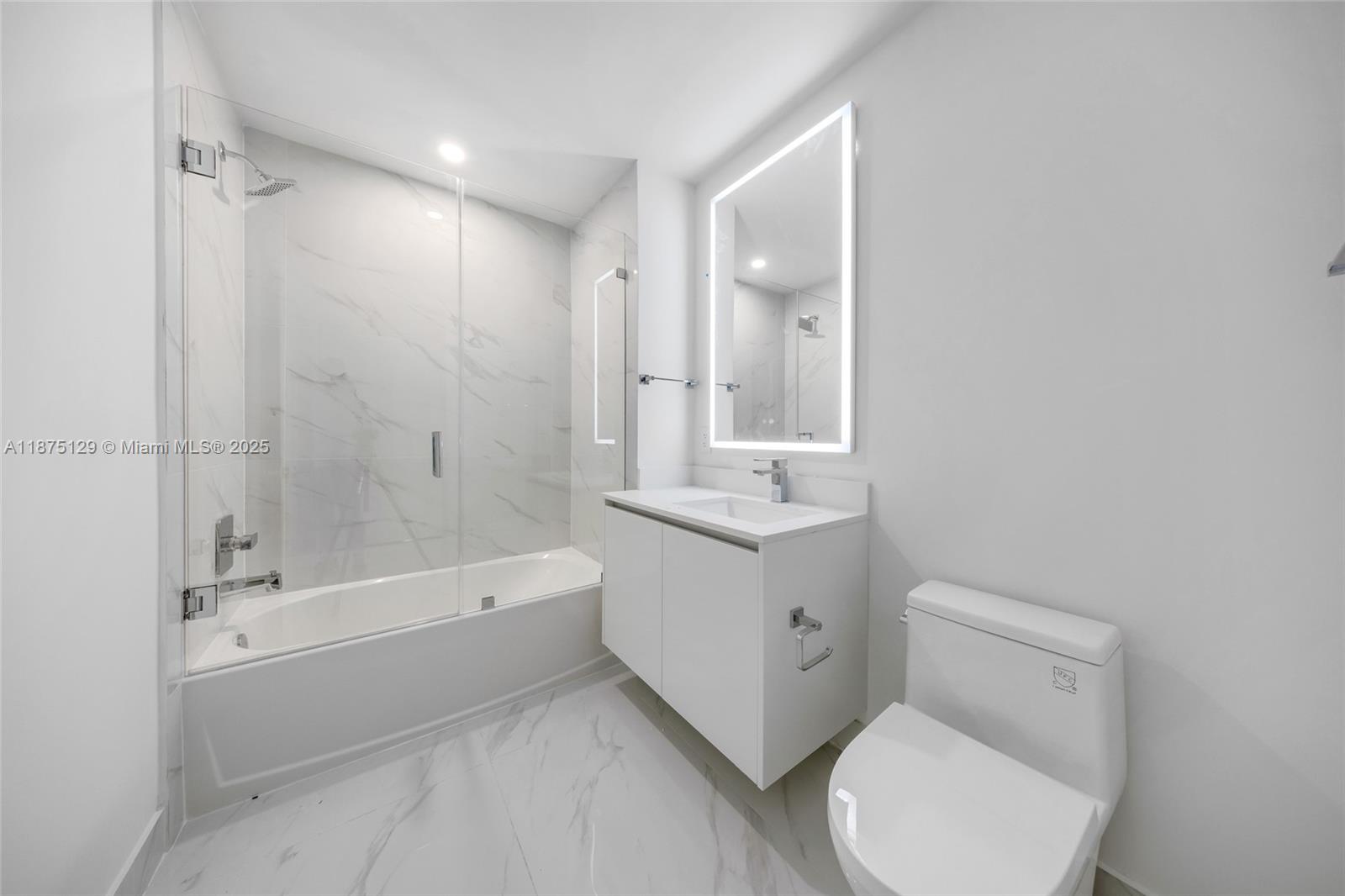 700 Northeast 24th Street, Unit 1706 Miami, FL 33137 - Photo 35 of 95 a bathroom with a toilet sink and shower