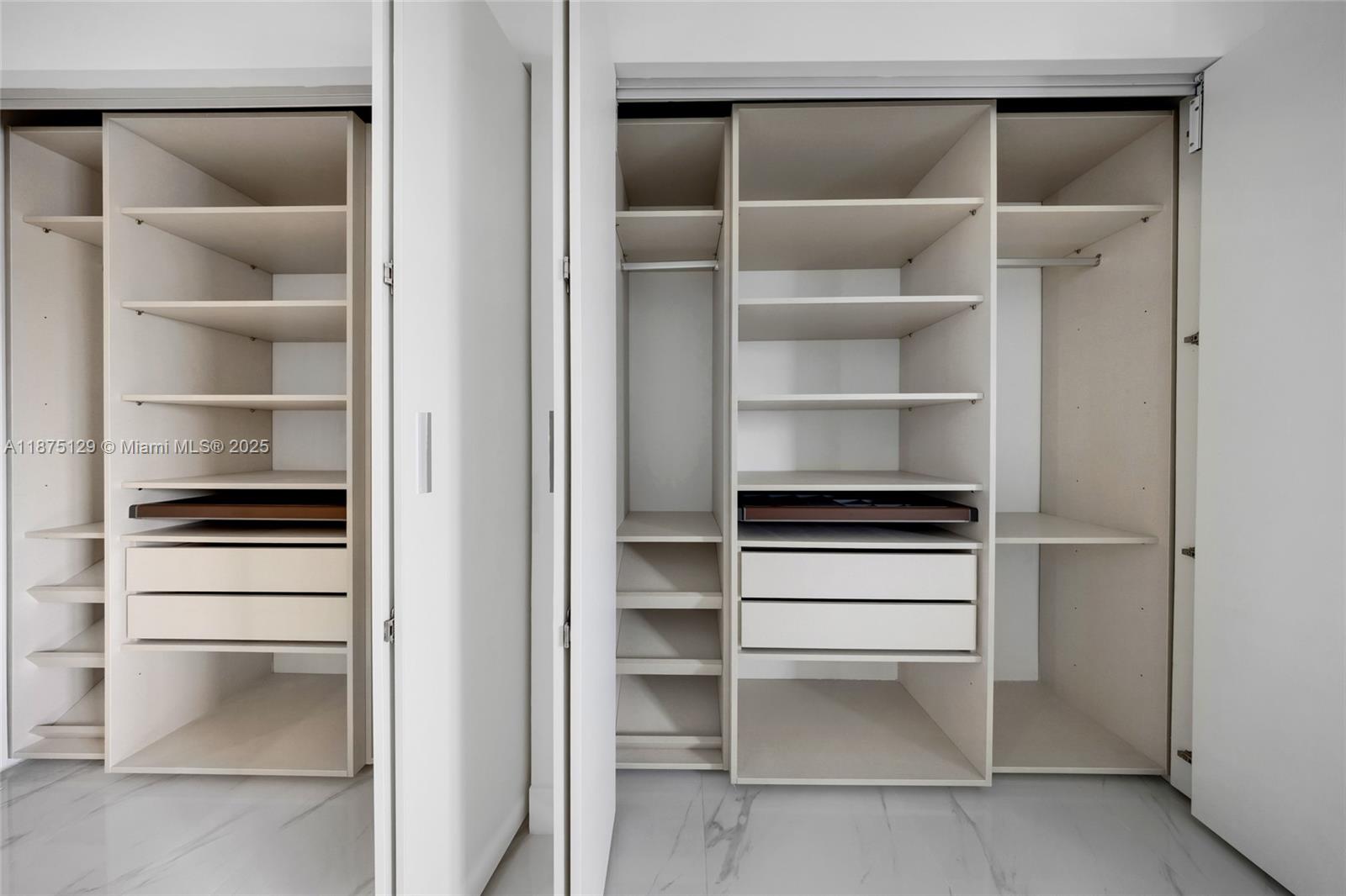 700 Northeast 24th Street, Unit 1706 Miami, FL 33137 - Photo 38 of 95 a view of walk in closet with empty racks