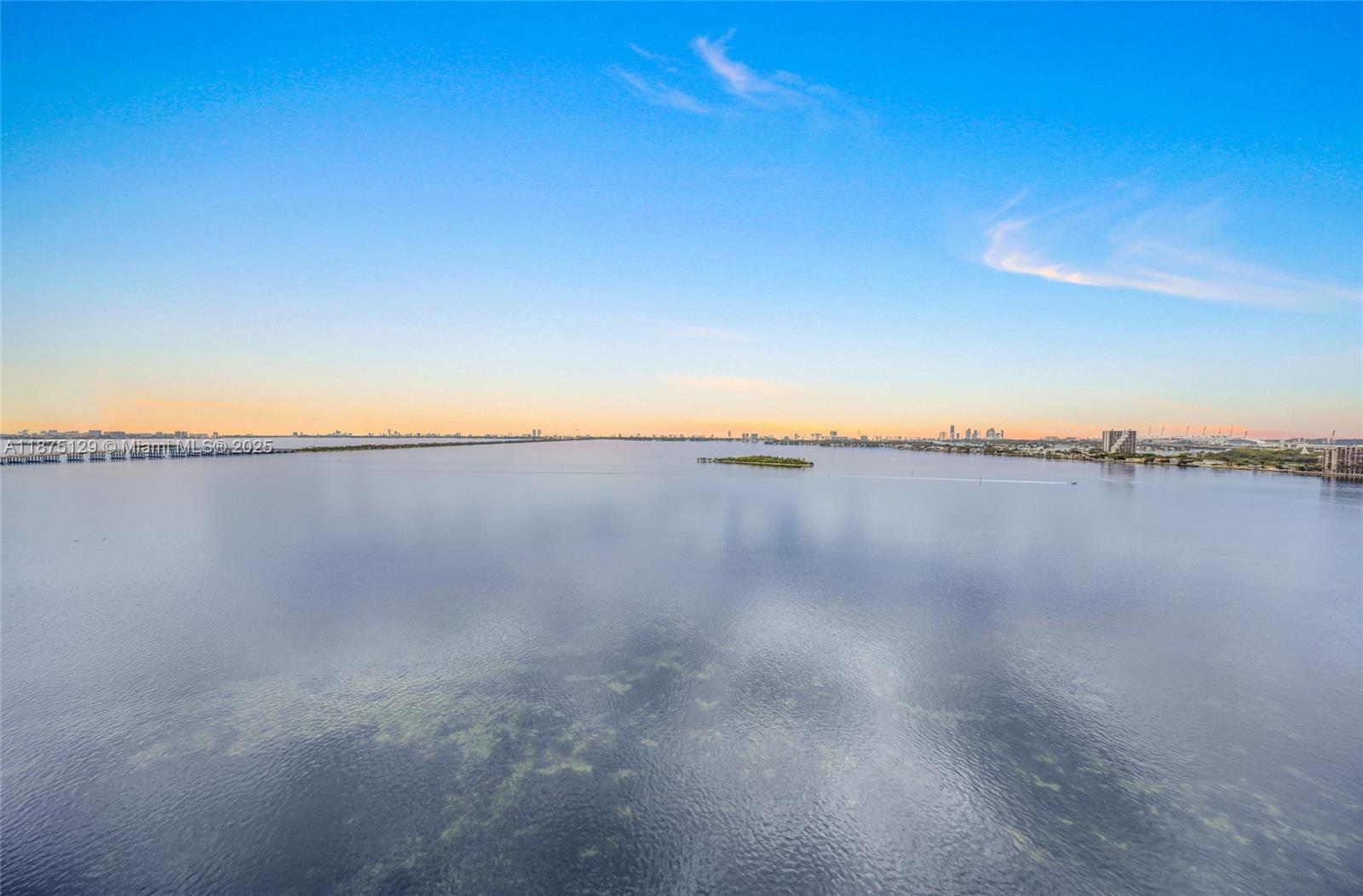 700 Northeast 24th Street, Unit 1706 Miami, FL 33137 - Photo 5 of 95 a view of a lake and mountain in the back