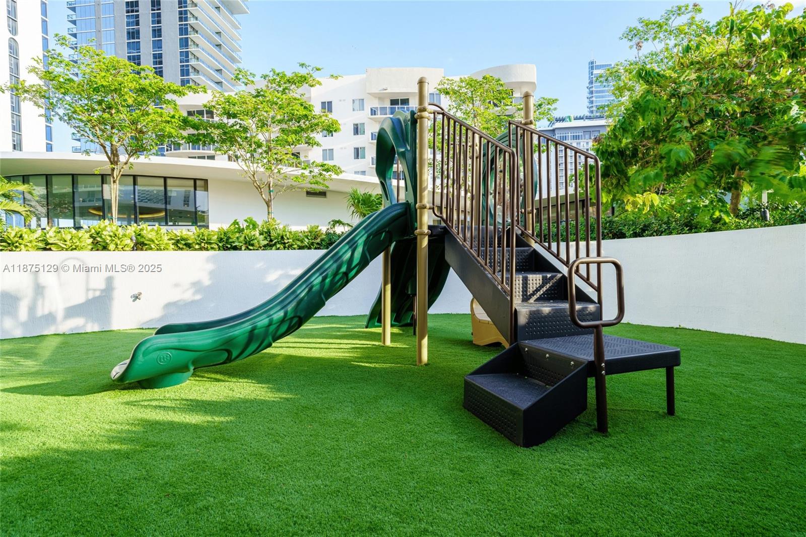700 Northeast 24th Street, Unit 1706 Miami, FL 33137 - Photo 57 of 95 a view of a garden with a slide