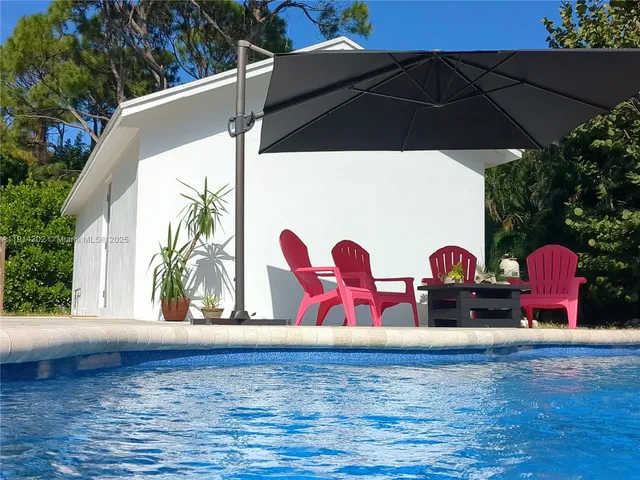 a view of swimming pool with a patio