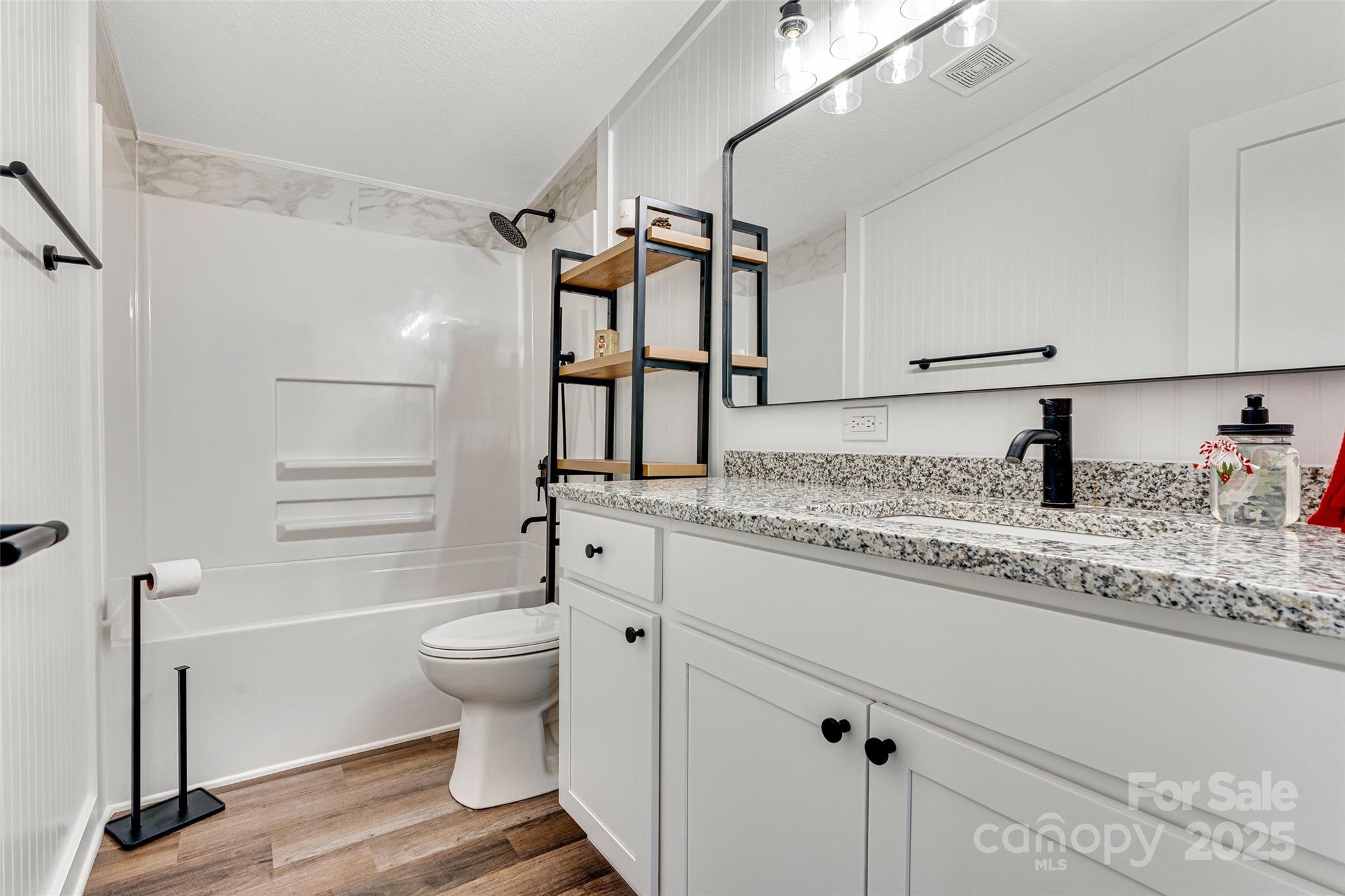 4881 Grassy Creek Road Denver, NC 28037 - Photo 13 of 25 a bathroom with a granite countertop sink toilet and shower