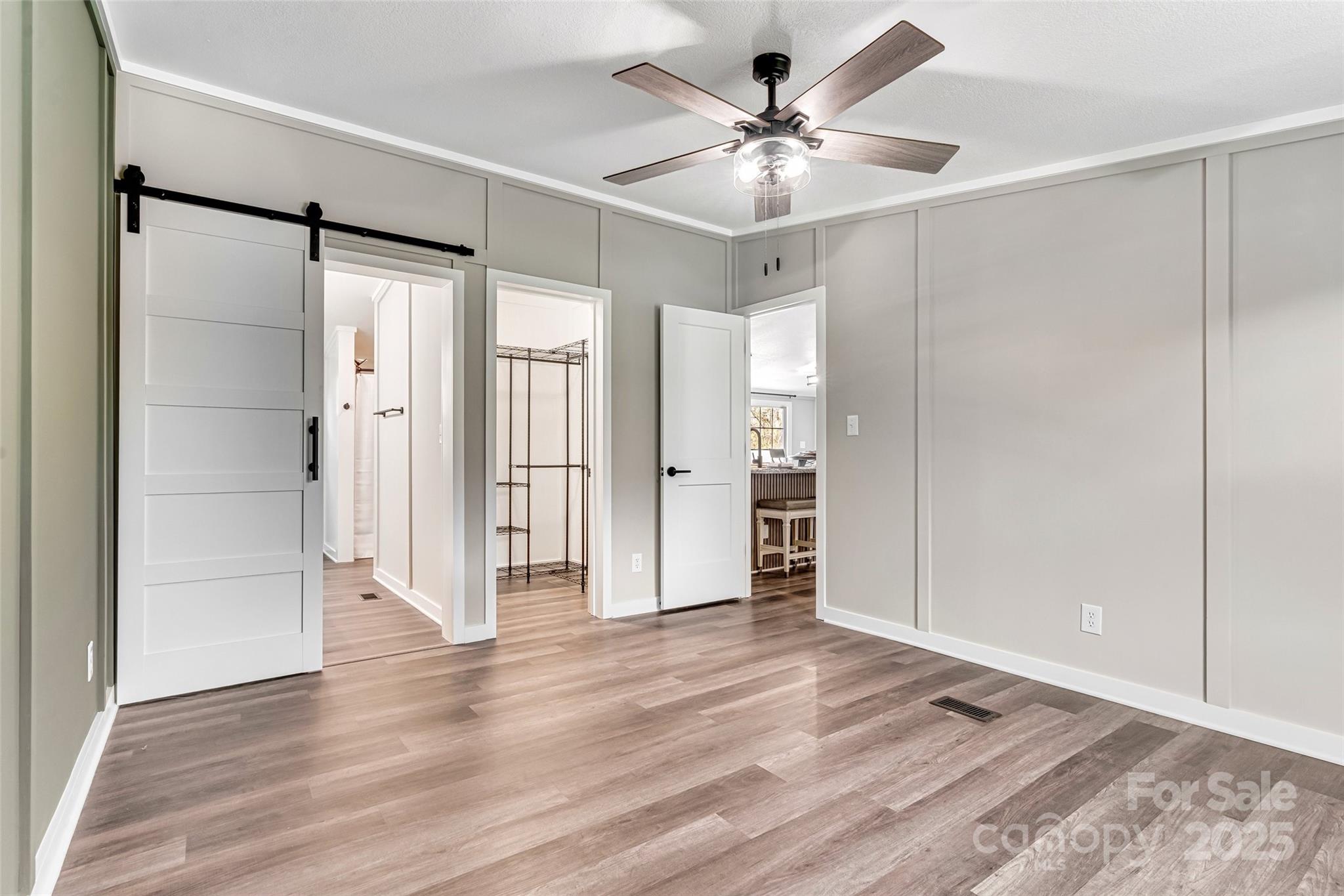 4881 Grassy Creek Road Denver, NC 28037 - Photo 14 of 25 a view of an empty room with wooden floor