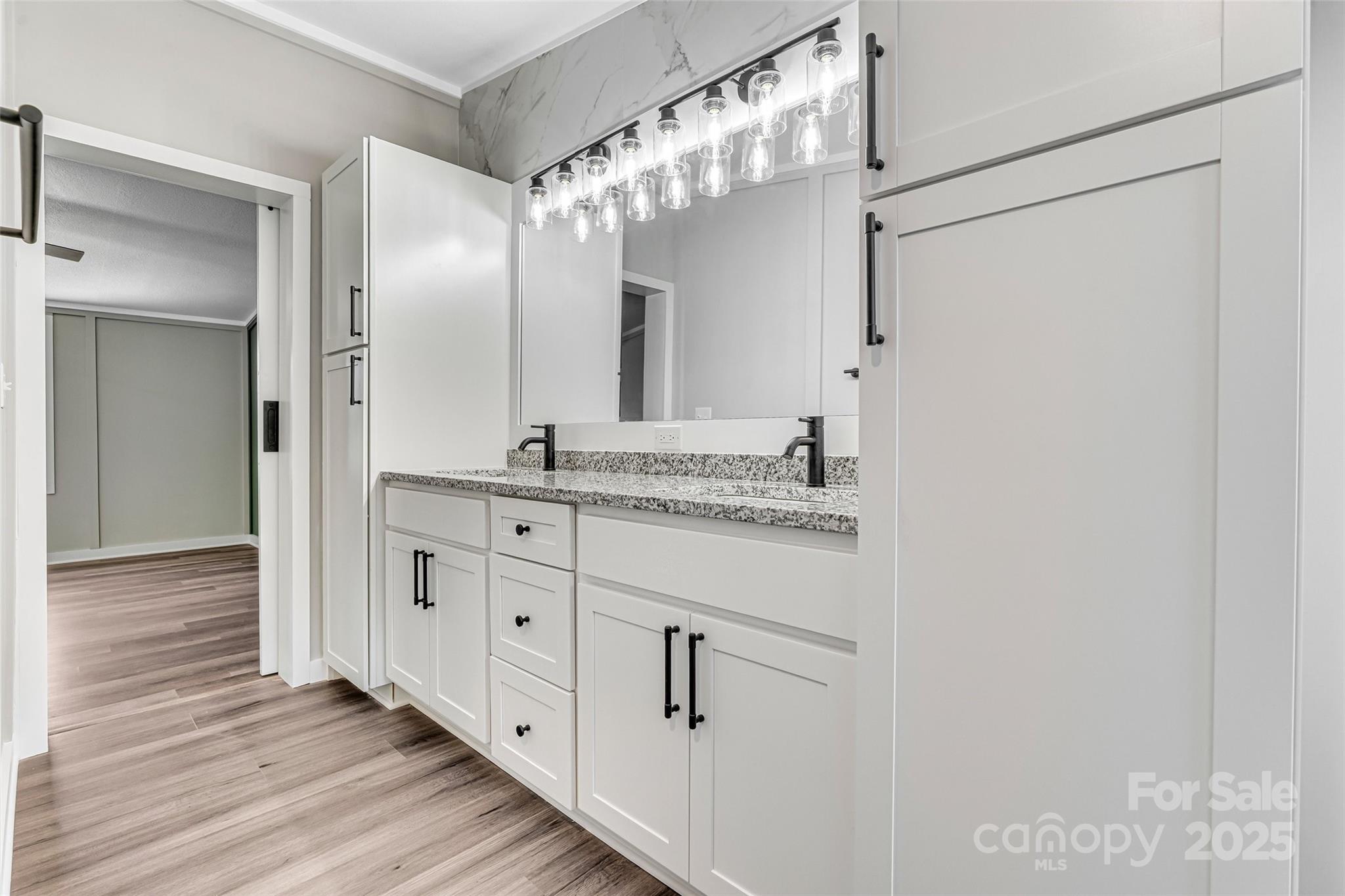 4881 Grassy Creek Road Denver, NC 28037 - Photo 17 of 25 a bathroom with a double vanity sink and mirror