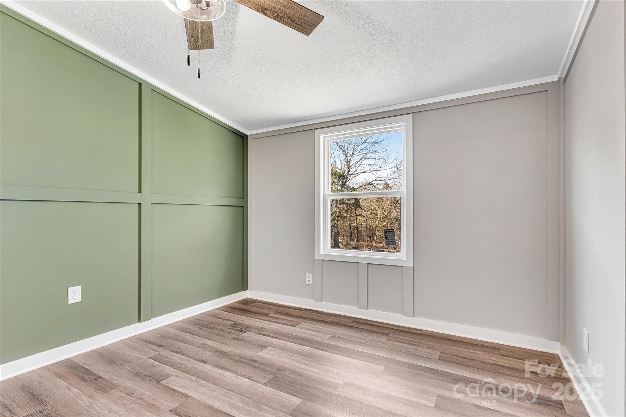 4881 Grassy Creek Road Denver, NC 28037 - Photo 20 of 25 a view of an empty room with a window