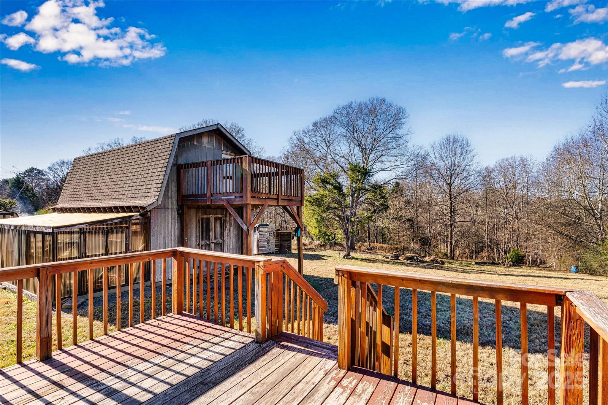 4881 Grassy Creek Road Denver, NC 28037 - Photo 24 of 25 a view of a wooden chairs on the roof deck