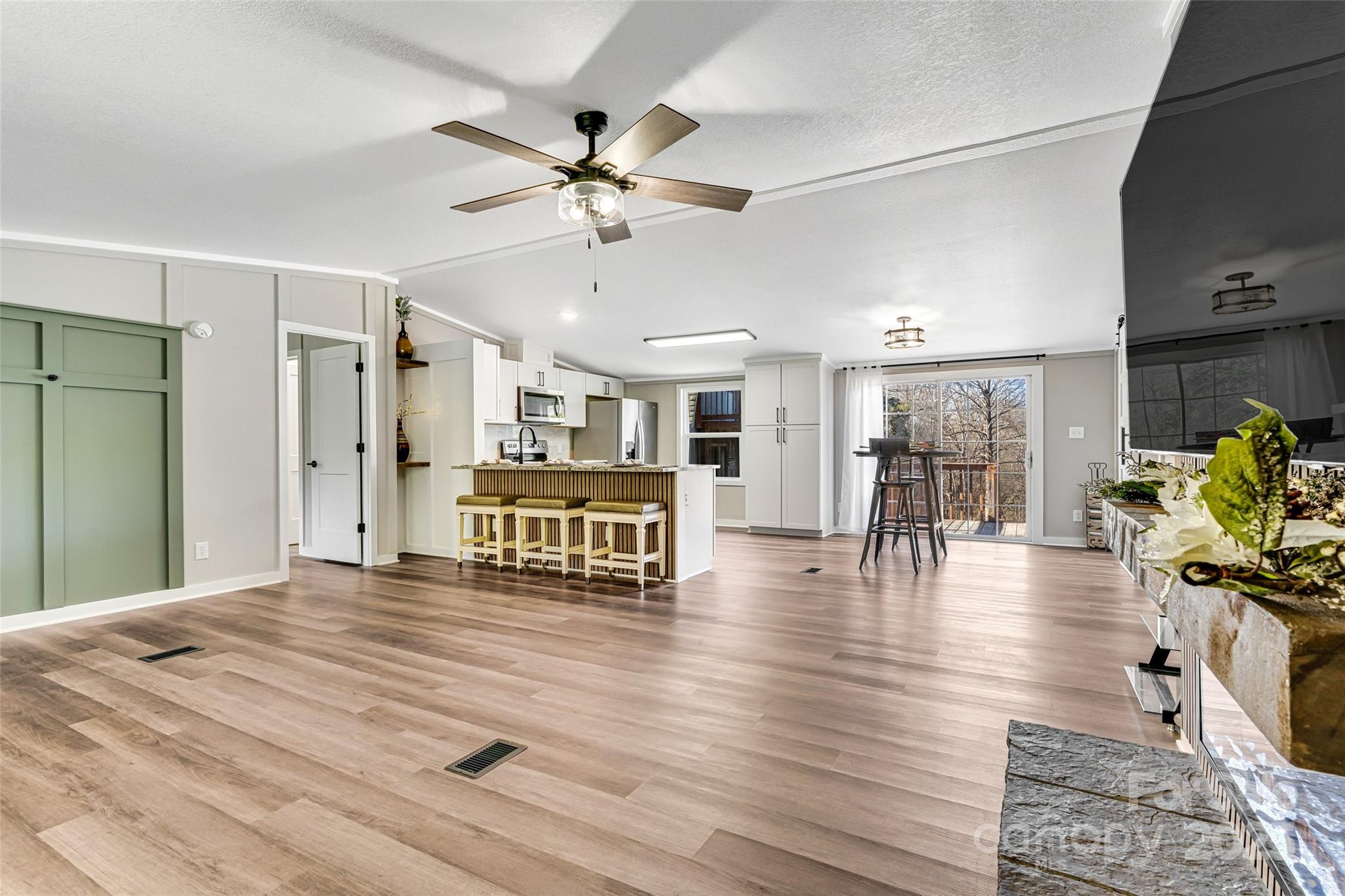 4881 Grassy Creek Road Denver, NC 28037 - Photo 6 of 25 a view of a livingroom with furniture and a flat screen tv