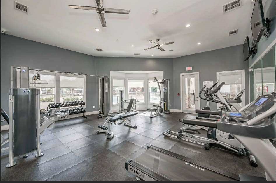 529 Barker-Clodine Road, Unit VERBANA Houston, TX 77094 - Photo 2 of 17 a view of a room with gym equipment