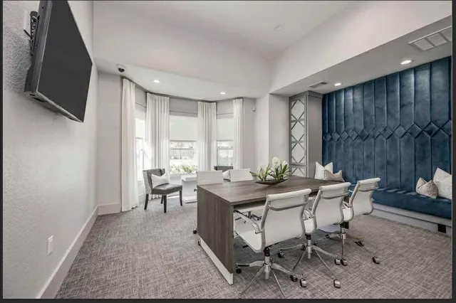 a view of a livingroom with furniture and window