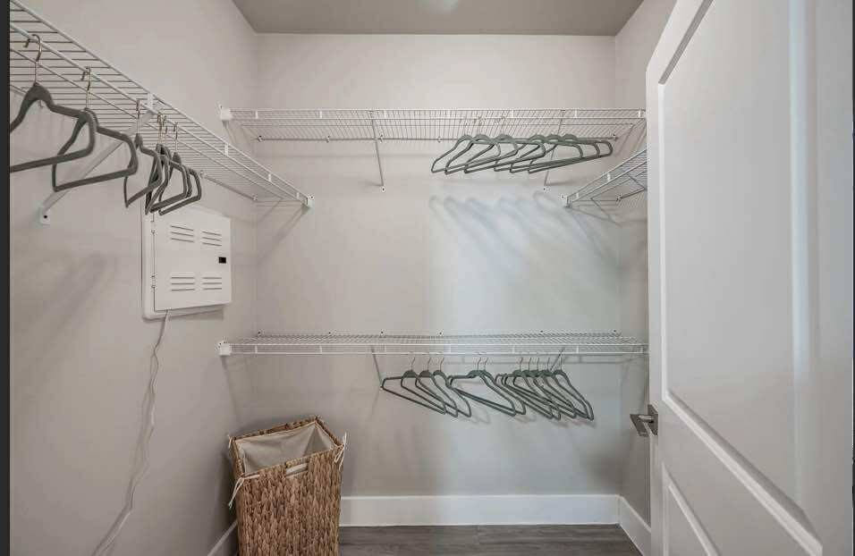 529 Barker-Clodine Road, Unit VERBANA Houston, TX 77094 - Photo 10 of 17 a view of walk in closet with clothes and shoes