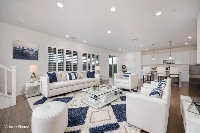 an empty room with wooden floor and a window