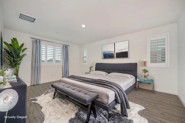 a bedroom with a bed and a dresser