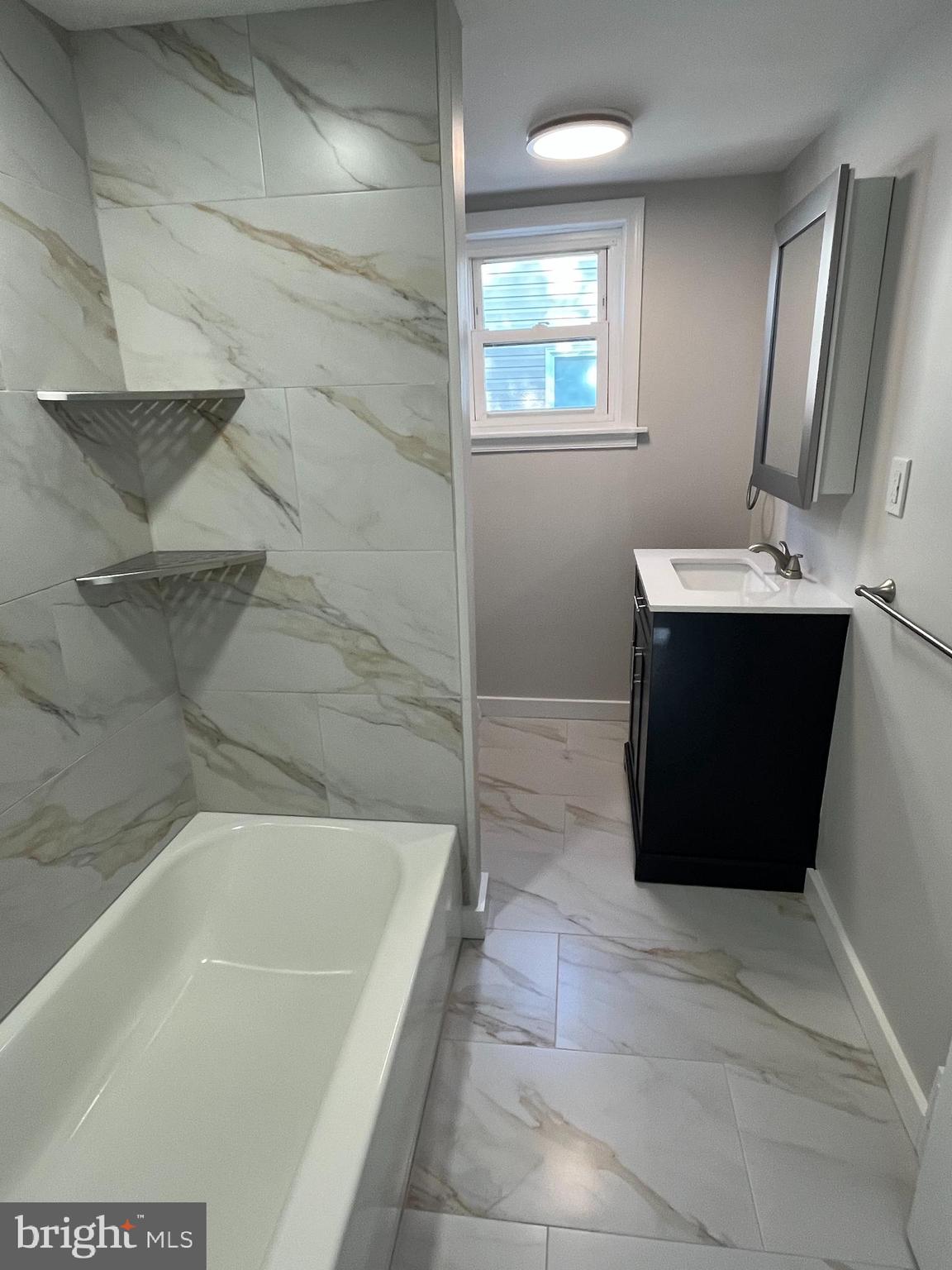 105 Mecray Lane Maple Shade, NJ 08052 - Photo 13 of 32 a bathroom with a bathtub sink and mirror