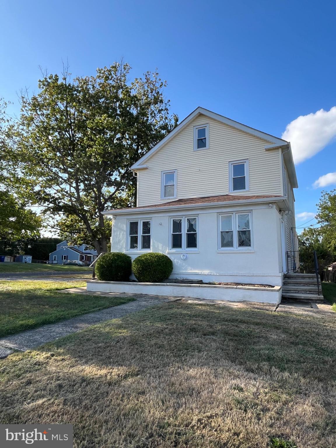 105 Mecray Lane Maple Shade, NJ 08052 - Photo 2 of 32 a view of a yard in front of a house with large trees