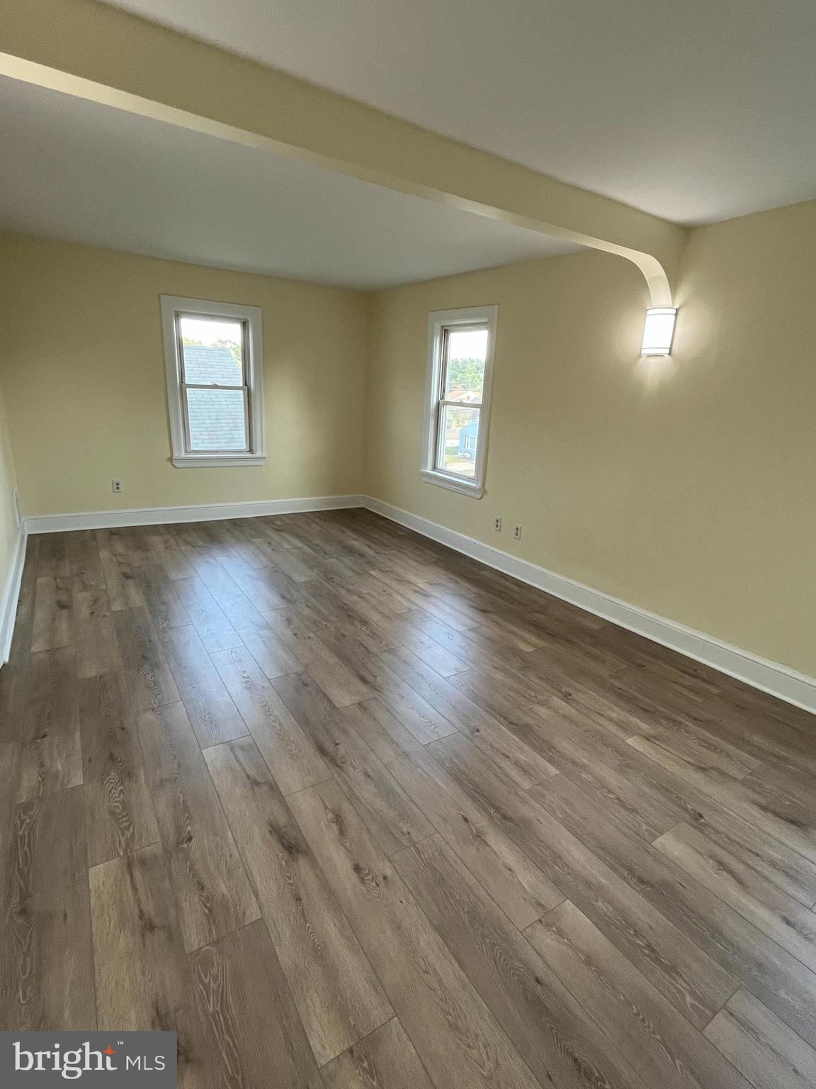 105 Mecray Lane Maple Shade, NJ 08052 - Photo 21 of 32 a view of an empty room with wooden floor and a window