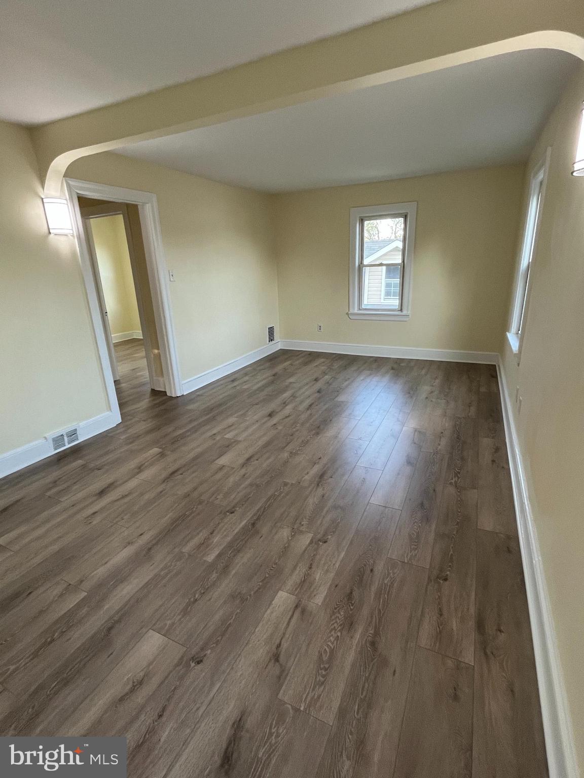 105 Mecray Lane Maple Shade, NJ 08052 - Photo 22 of 32 a view of an empty room with wooden floor and a window