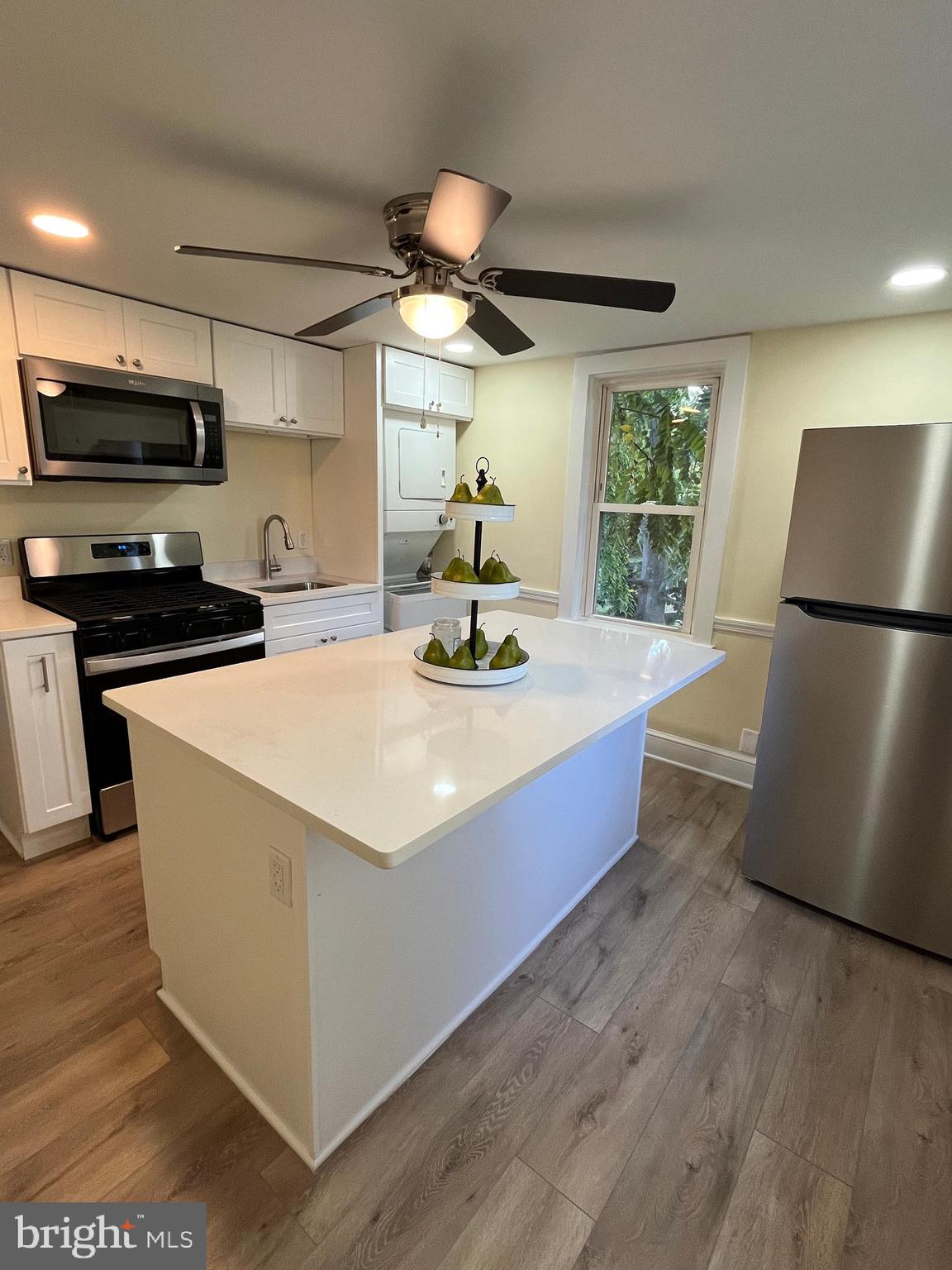 105 Mecray Lane Maple Shade, NJ 08052 - Photo 24 of 32 a kitchen with stainless steel appliances a stove a refrigerator a sink and a refrigerator