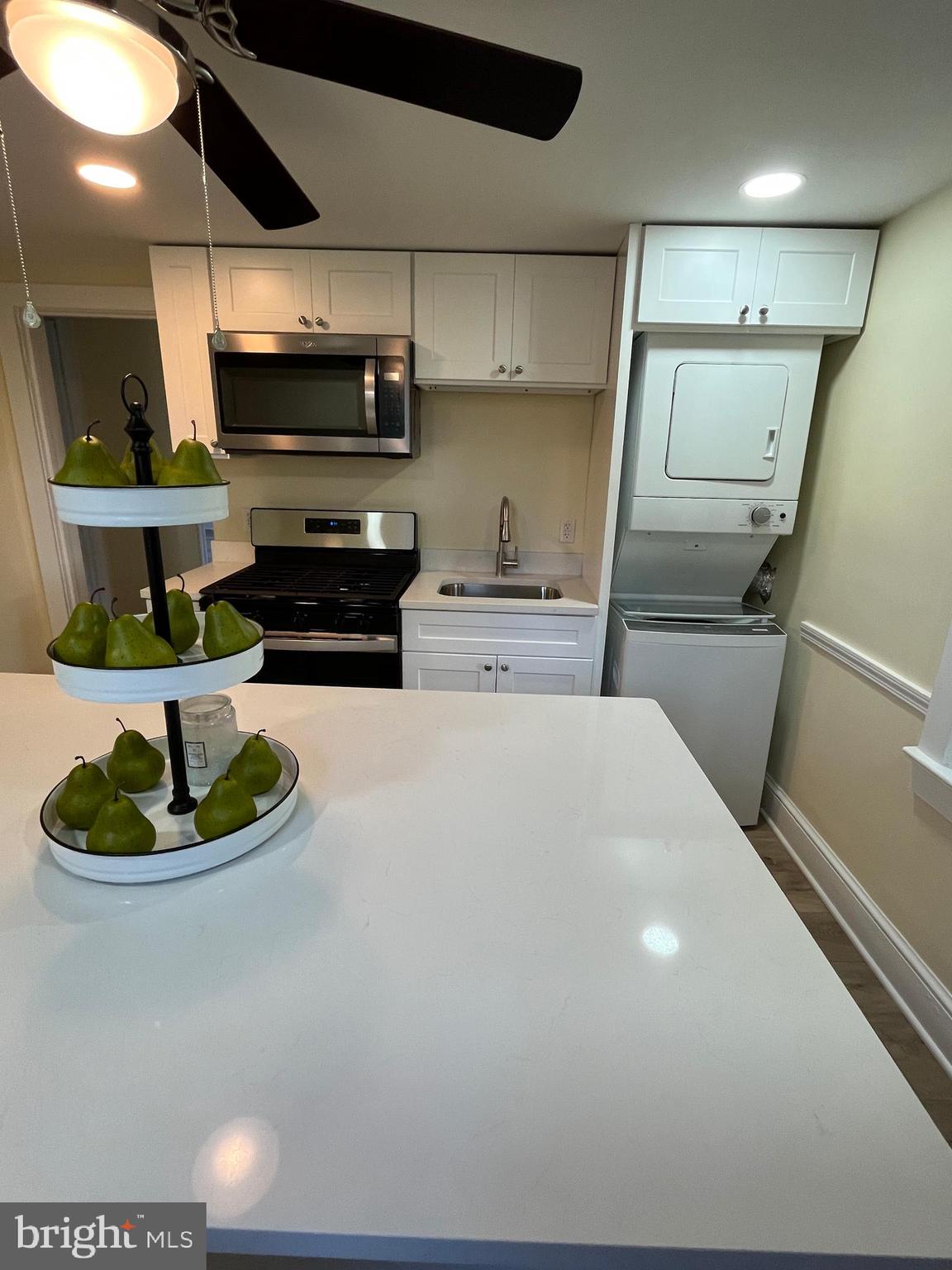 105 Mecray Lane Maple Shade, NJ 08052 - Photo 25 of 32 a kitchen with a sink stainless steel appliances and cabinets