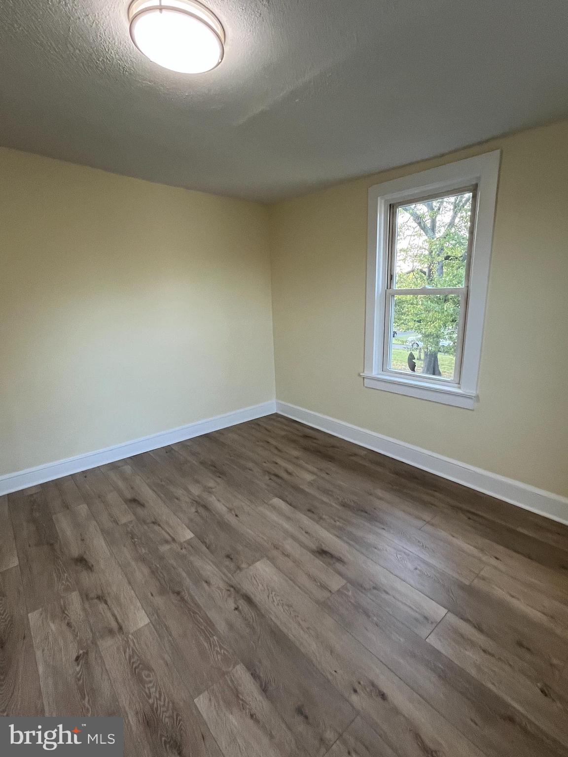 105 Mecray Lane Maple Shade, NJ 08052 - Photo 26 of 32 an empty room with wooden floor and windows