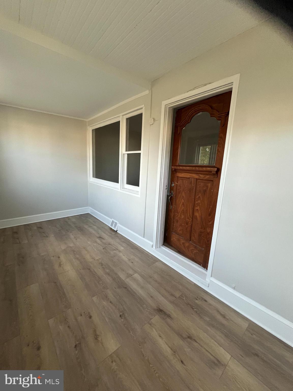105 Mecray Lane Maple Shade, NJ 08052 - Photo 3 of 32 a view of an empty room with wooden floor and a window