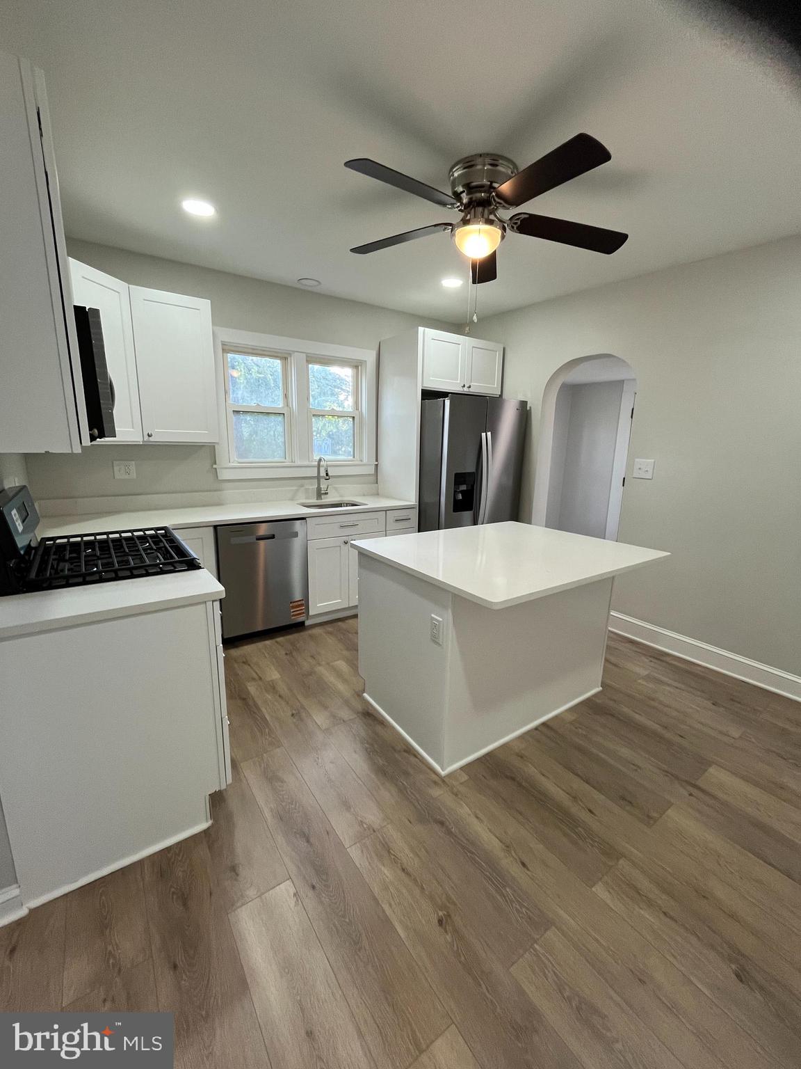 105 Mecray Lane Maple Shade, NJ 08052 - Photo 7 of 32 a large white kitchen with a large window