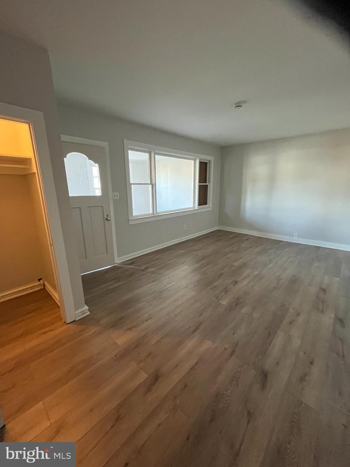 105 Mecray Lane Maple Shade, NJ 08052 - Photo 10 of 32 an empty room with wooden floor and windows
